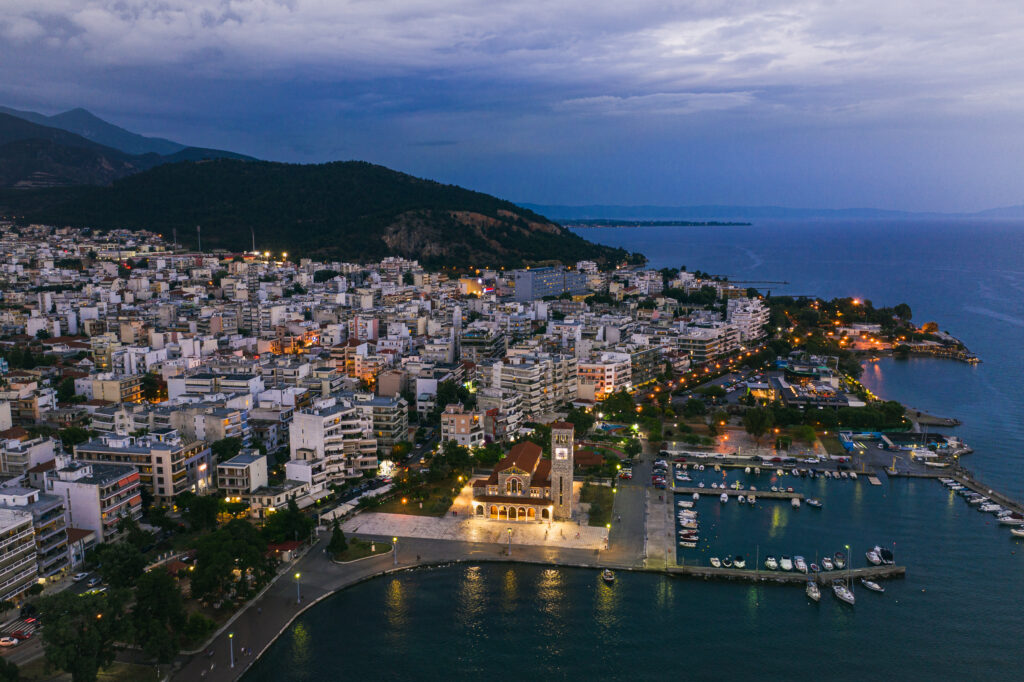 Aerial panoramic view of Volos city at twilight Magnesia
